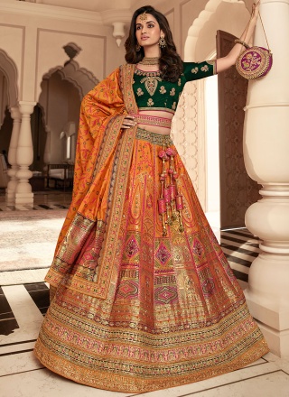 Flamboyant Weaving Green and Orange Banarasi Silk Designer Lehenga Choli