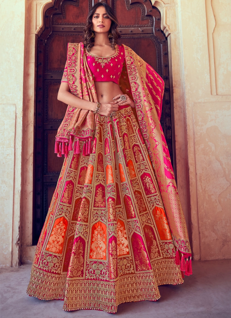 Immaculate Orange and Pink Embroidered Silk Lehenga Choli