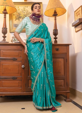 Resplendent Turquoise Embroidered Traditional Saree